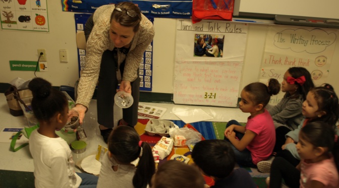 “It smells just like wet forest” Trinity K students learn how to sort their waste and what compost is.